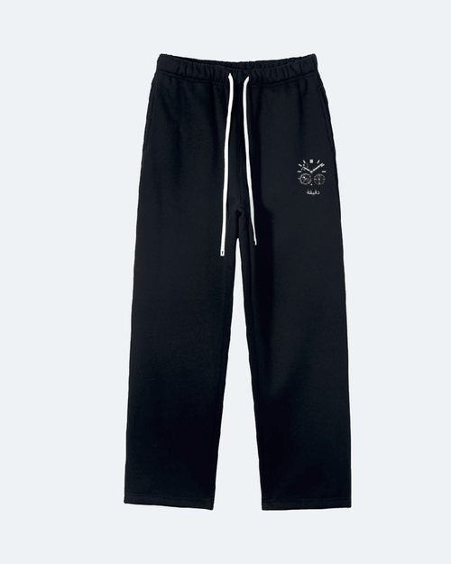 Black Moon Tide Sweatpants with a small logo on a white background