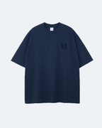Navy blue Moon Tide T-Shirt with a logo on the chest against a light gray background