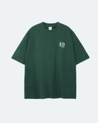 Green Newman Era T-Shirt with a logo on a light gray background