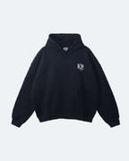 Black Oman Edition Hoodie with a logo on a light gray background
