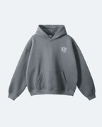 Gray Oman Edition Hoodie with a logo on a light gray background