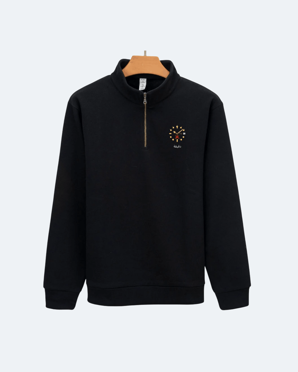 Black Oman Edition Quarter Zip sweatshirt with a small logo on a white background