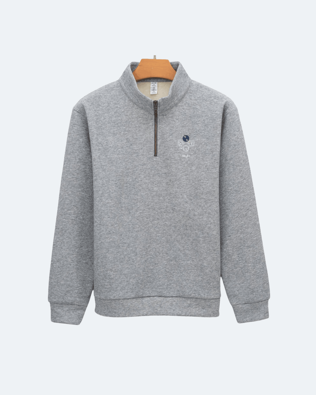 Gray Perpetual Flight Quarter Zip sweatshirt with a small logo on a white background