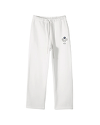White Perpetual Flight Trackpants  pants with a small logo on a white background