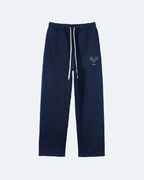 Navy blue Perpetual Flight Trackpants  sweatpants with a small logo on a white background